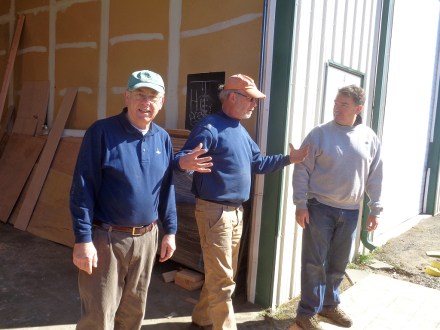 Al is skeptical about the size of Jon's fish.