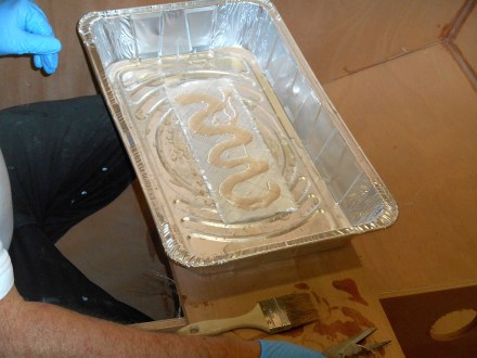 Epoxy poured on tape in the pasta pan