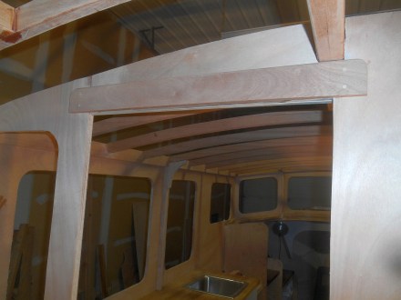 Mahogany lintel helps support the central beam and ties bulkhead parts together.