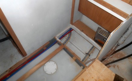 Final pipe runs up to the head and shower, down to the holding tank.