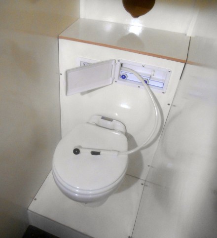 The shower -- such as it is -- pulls out from the box on the wall that also holds the hot and cold controls.