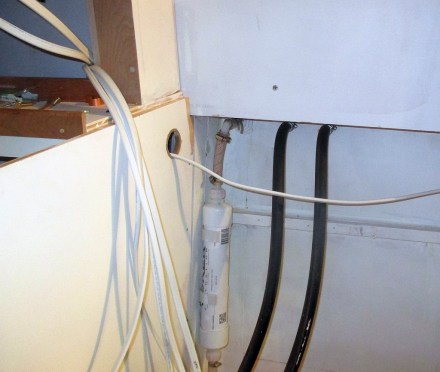 Fuel and poop tank vents.  (All the wire run holes are lined with weather stripping to prevent chafe)